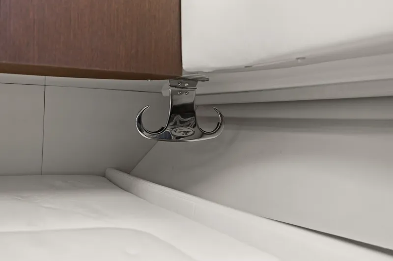 Slide: The Image of Chrome hook detail in 2023 Grady-White Canyon 456 boat interior. - 50