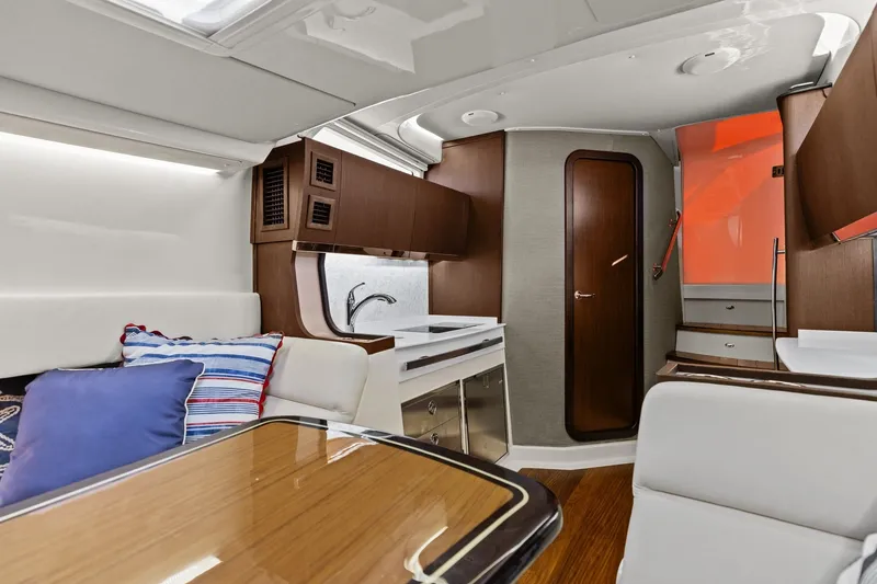 Slide: The Image of Luxurious interior of 2023 Grady-White Canyon 456 boat with modern kitchen and seating area. - 51