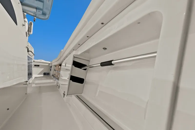 Slide: The Image of 2023 Grady-White Canyon 456 boat interior with storage compartments and sleek design. - 69
