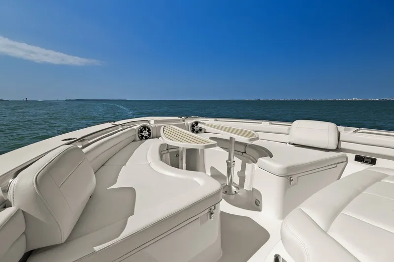 Slide: The Image of 2023 Grady-White Canyon 456 boat interior with luxurious seating and ocean view. - 59