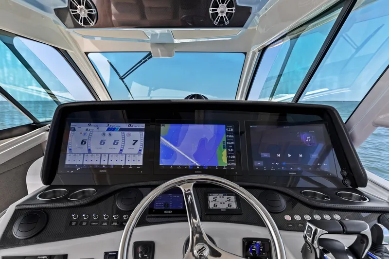 Slide: The Image of Dashboard of 2023 Grady-White Canyon 456 boat with advanced navigation displays. - 44