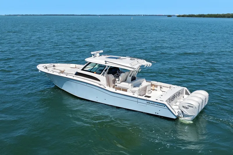 Slide: The Image of 2023 Grady-White Canyon 456 boat cruising on open water. - 8