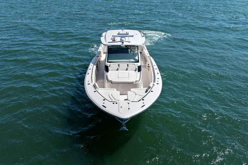 Slide: The Image of 2023 Grady-White Canyon 456 boat cruising on open water. - 9