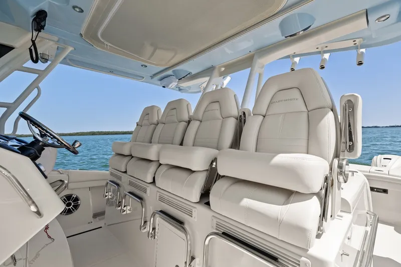 Slide: The Image of 2023 Grady-White Canyon 456 boat interior with luxurious seating and ocean view. - 42