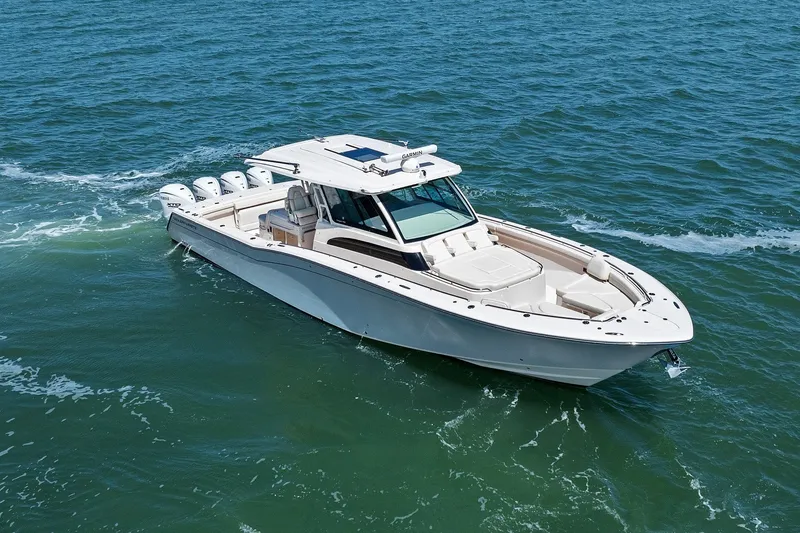Slide: The Image of 2023 Grady-White Canyon 456 boat cruising on open water. - 22