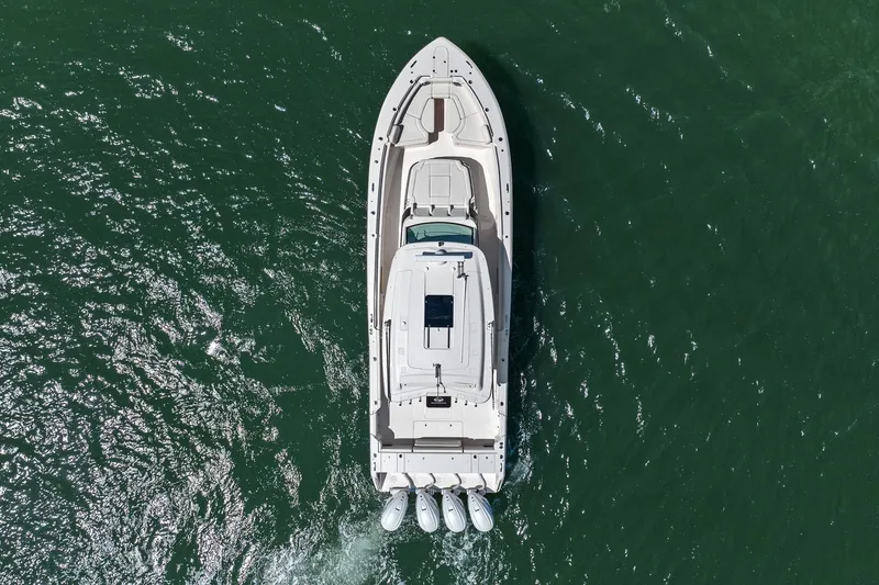 Slide: The Image of Aerial view of 2023 Grady-White Canyon 456 boat cruising on open water. - 27