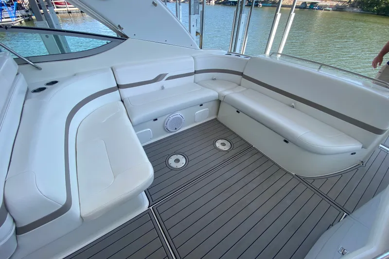 Slide: The Image of Spacious seating area on a 2000 Formula 400 Super Sport boat, docked by the water. - 9