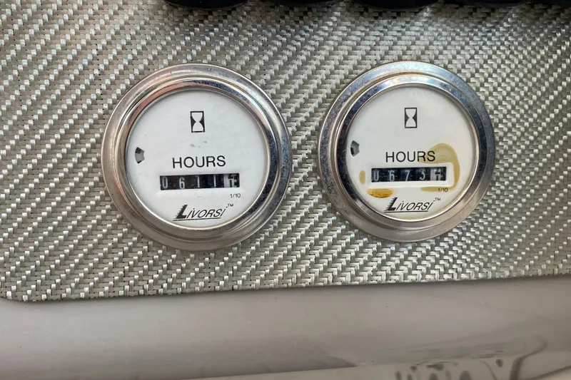 Slide: The Image of Hour meters on a 2000 Formula 400 Super Sport boat dashboard. - 26