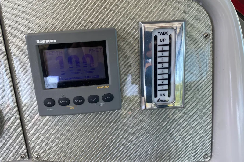 Slide: The Image of Raytheon depth gauge and Livorsi trim tab indicator on 2000 Formula 400 Super Sport boat. - 21