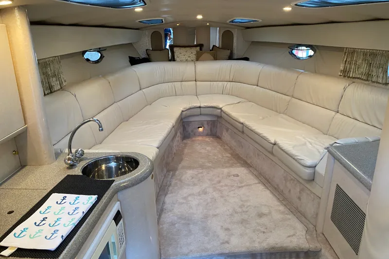 Slide: The Image of Luxurious interior of a 2000 Formula 400 Super Sport yacht with plush seating and kitchenette. - 30