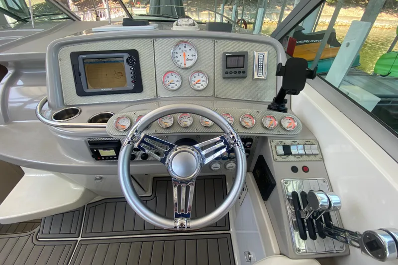 Slide: The Image of Control panel of a 2000 Formula 400 Super Sport boat with gauges and steering wheel. - 18