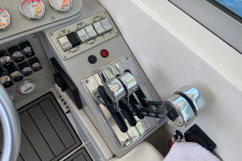 Slide: The Image of Control panel of a 2000 Formula 400 Super Sport boat with throttle levers and gauges. - 27