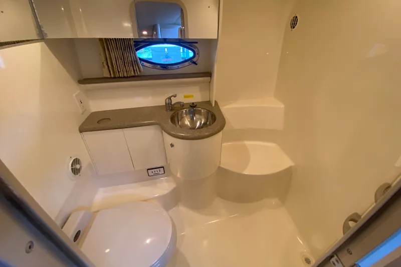 Slide: The Image of Bathroom interior of a 2000 Formula 400 Super Sport boat, featuring sink and toilet. - 35