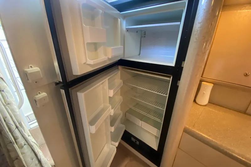 Slide: The Image of Open refrigerator inside a 2000 Formula 400 Super Sport boat cabin. - 41