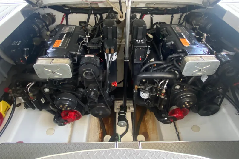 Slide: The Image of Engine compartment of a 2000 Formula 400 Super Sport boat, showcasing dual engines. - 47