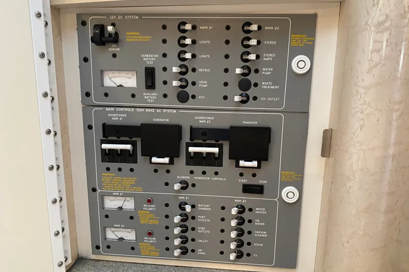 Slide: The Image of Control panel of a 2000 Formula 400 Super Sport boat, featuring various switches and gauges. - 33