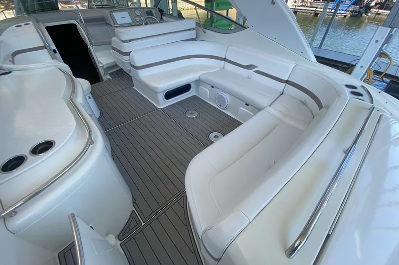 Slide: The Image of 2000 Formula 400 Super Sport boat interior with white seating and sleek design. - 8