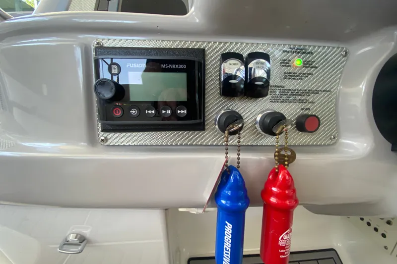 Slide: The Image of Control panel of a 2000 Formula 400 Super Sport boat with ignition keys and switches. - 22