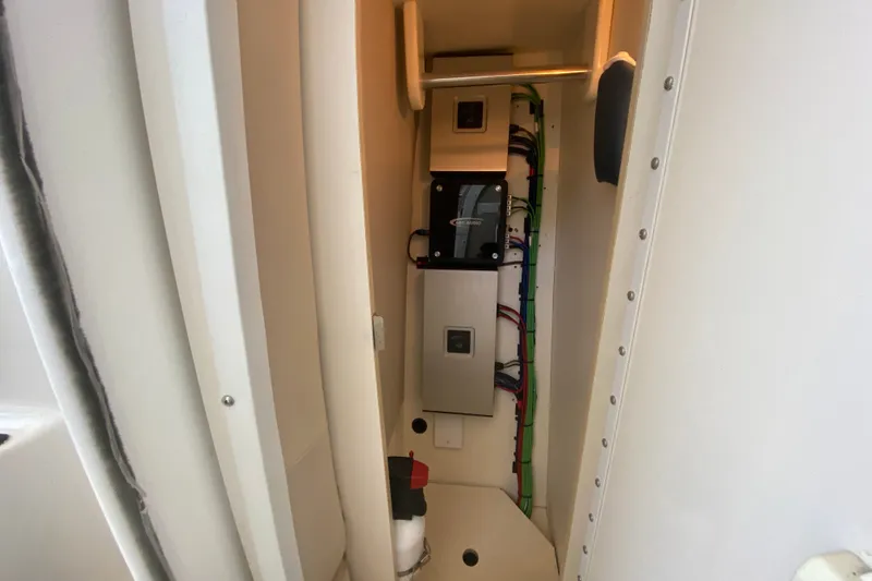 Slide: The Image of Electrical panel inside a 2000 Formula 400 Super Sport boat, showcasing wiring and components. - 40