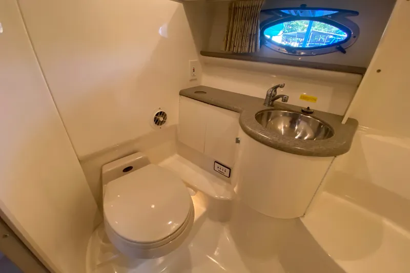 Slide: The Image of Bathroom interior of 2000 Formula 400 Super Sport boat with sink and toilet. - 43