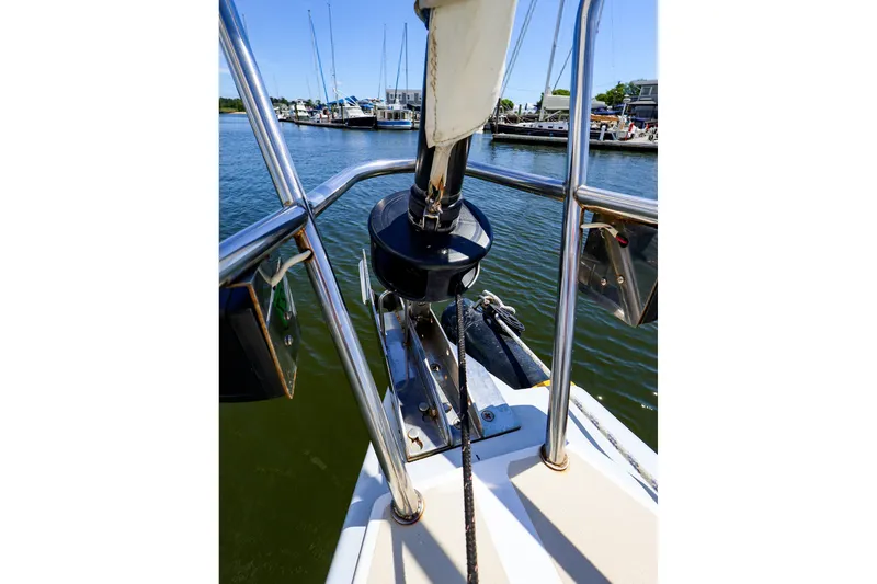 Slide: The Image of Bow view of a 2002 J Boats J/120 sailboat docked in a marina. - 23