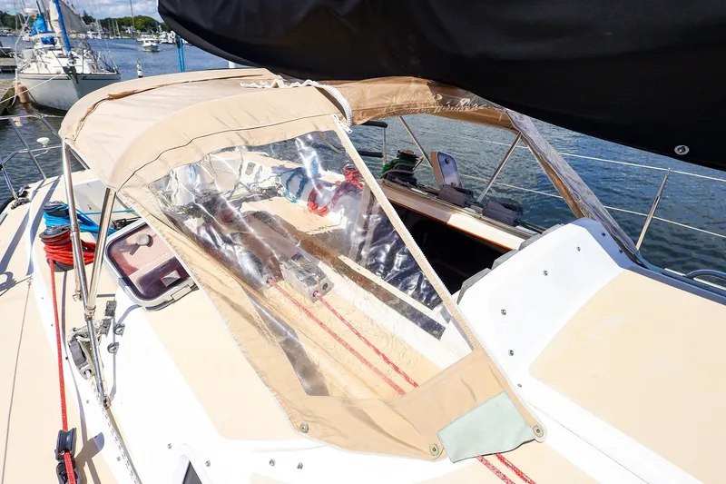 Slide: The Image of 2002 J Boats J/120 sailboat cockpit with protective canopy and visible rigging. - 31
