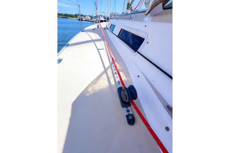 Slide: The Image of Deck view of a 2002 J Boats J/120 sailboat, featuring rigging and sleek design. - 21