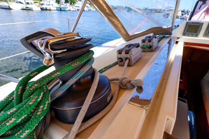 Slide: The Image of Close-up of a 2002 J Boats J/120 sailboat deck with winch and ropes. - 32