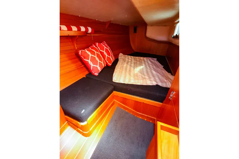Slide: The Image of Cozy cabin interior of 2002 J Boats J/120 with wooden finish and comfortable bedding. - 55