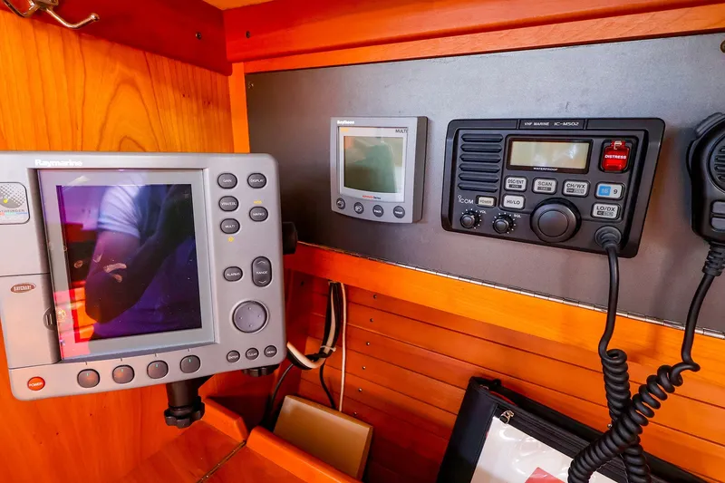 Slide: The Image of Navigation equipment on a 2002 J Boats J/120 sailboat, featuring Raymarine and Icom devices. - 41