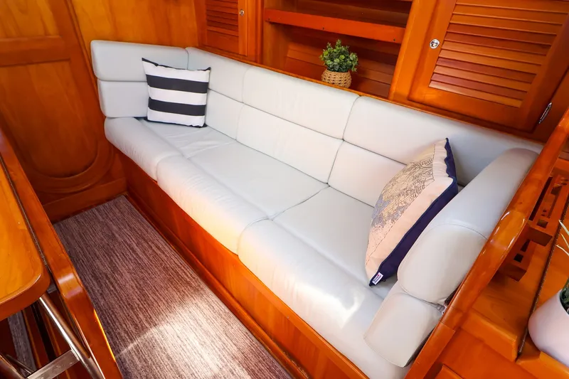 Slide: The Image of Luxurious interior of 2002 J Boats J/120 with white leather seating and decorative pillows. - 47