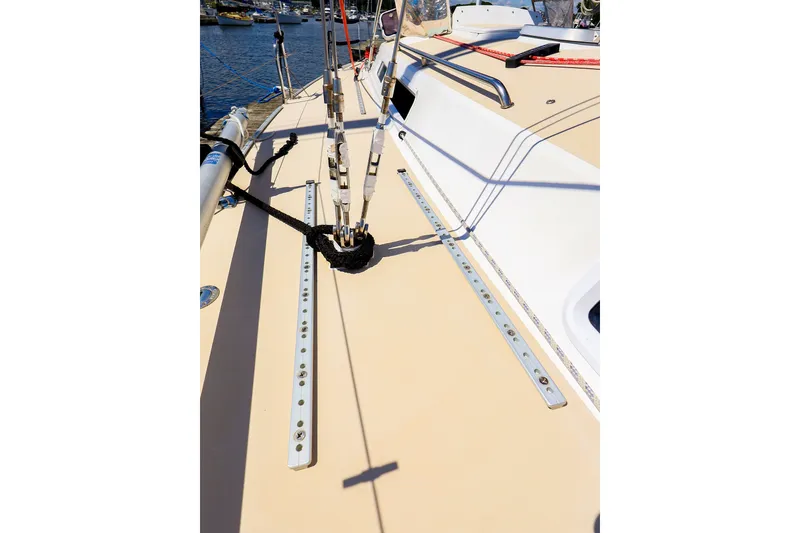 Slide: The Image of Deck view of a 2002 J Boats J/120 sailboat, showcasing rigging and fittings. - 25