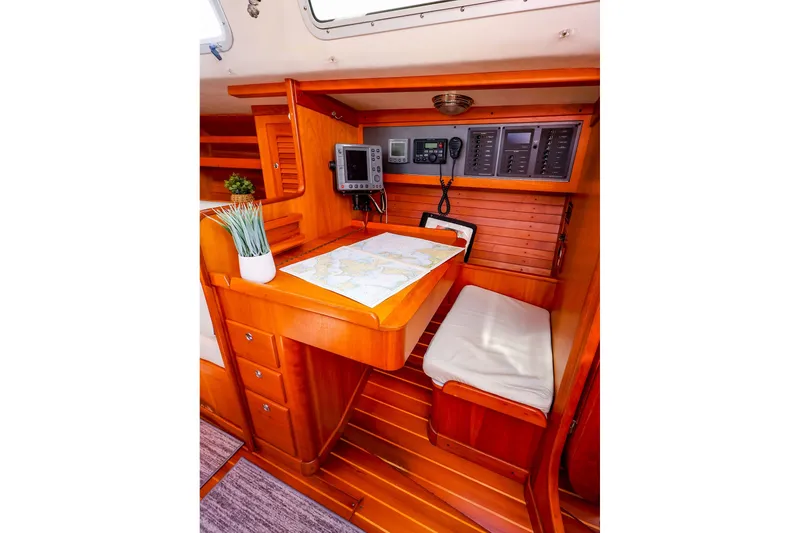 Slide: The Image of Navigation station inside 2002 J Boats J/120 sailboat with chart table and instruments. - 39