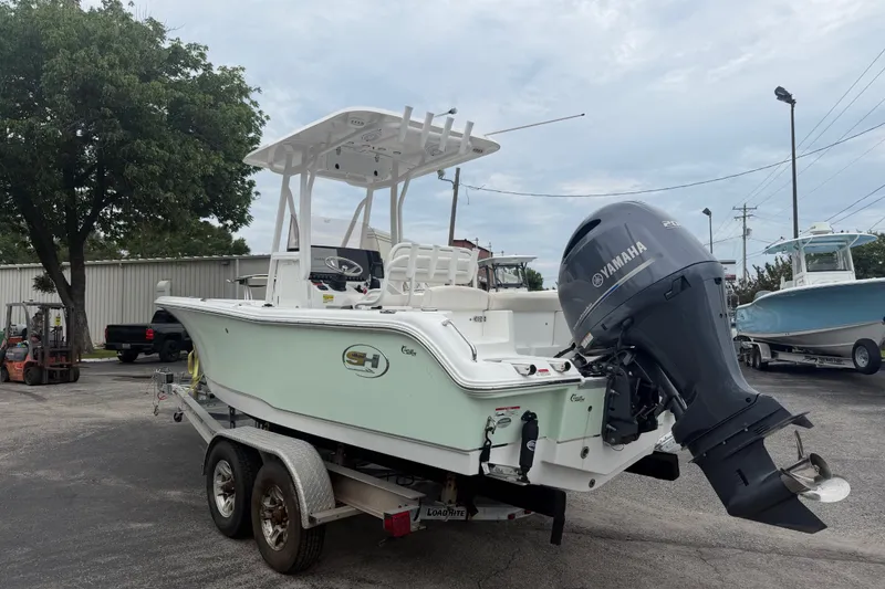 Slide: The Image of 2022 Sea Hunt Ultra 219 boat with Yamaha outboard motor on a trailer. - 5