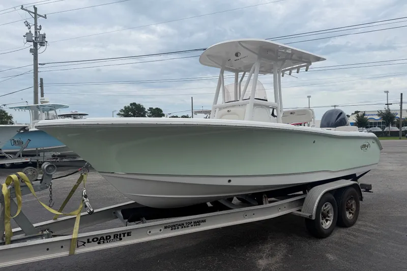 Slide: The Image of 2022 Sea Hunt Ultra 219 boat on trailer, parked outdoors. - 6