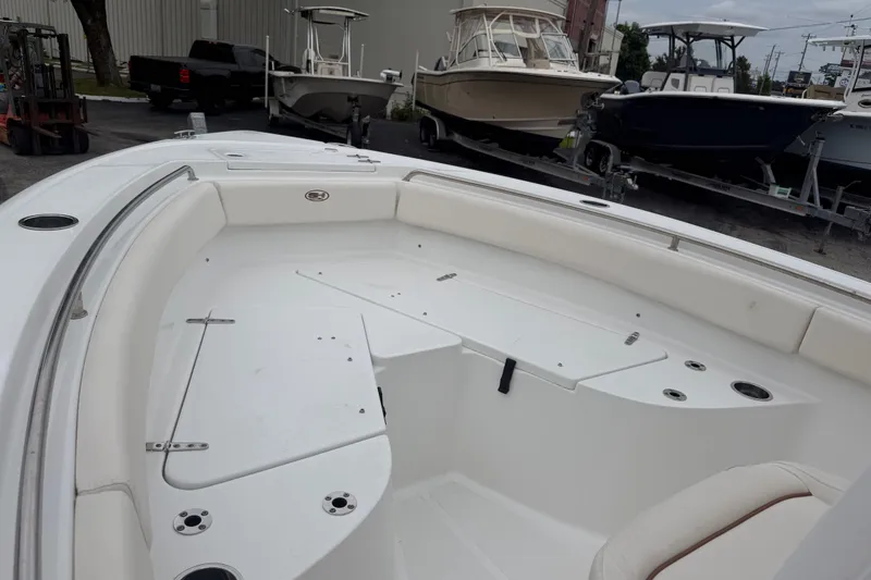 Slide: The Image of 2022 Sea Hunt Ultra 219 boat interior with seating and storage compartments. - 7
