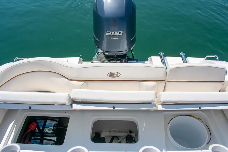 Slide: The Image of 2022 Sea Hunt Ultra 219 boat with Yamaha 200 engine, featuring comfortable seating and storage compartments. - 15