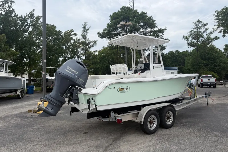 Slide: The Image of 2022 Sea Hunt Ultra 219 boat on trailer with Yamaha outboard motor. - 3