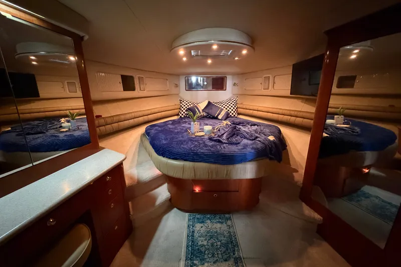 Slide: The Image of Luxurious 1997 Sea Ray 550 Sedan Bridge yacht interior with cozy bedroom and elegant decor. - 36