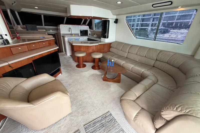 Slide: The Image of Luxurious interior of a 1997 Sea Ray 550 Sedan Bridge yacht with plush seating and modern amenities. - 22