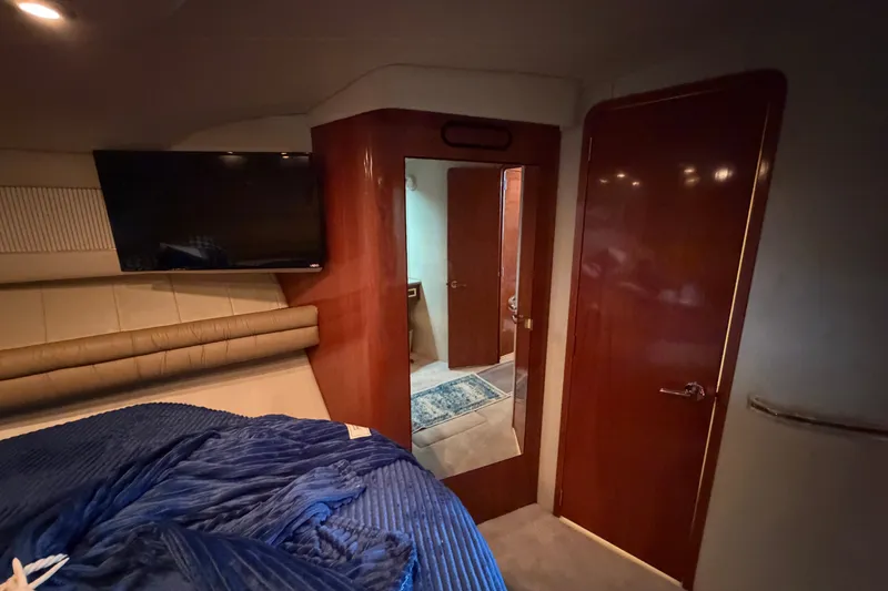 Slide: The Image of Luxurious interior of 1997 Sea Ray 550 Sedan Bridge yacht cabin with TV and mirror. - 38
