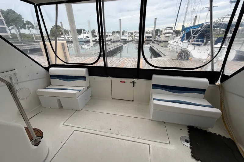 Slide: The Image of Interior view of 1997 Sea Ray 550 Sedan Bridge yacht at marina. - 8
