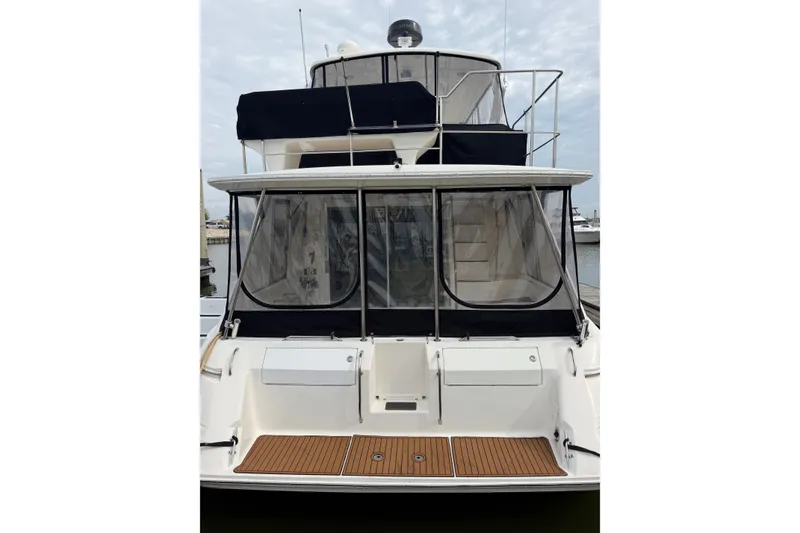 Slide: The Image of 1997 Sea Ray 550 Sedan Bridge yacht with enclosed deck and wooden flooring. - 9