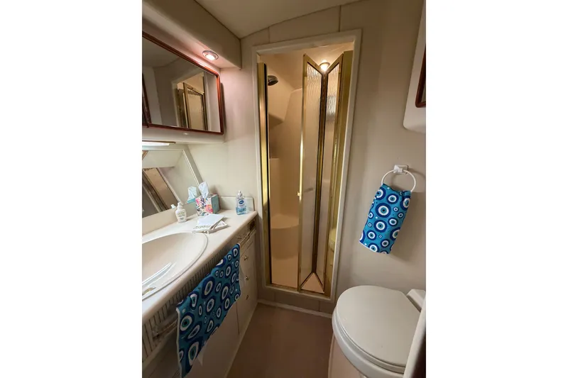 Slide: The Image of Bathroom interior of 1997 Sea Ray 550 Sedan Bridge yacht with shower and sink. - 40