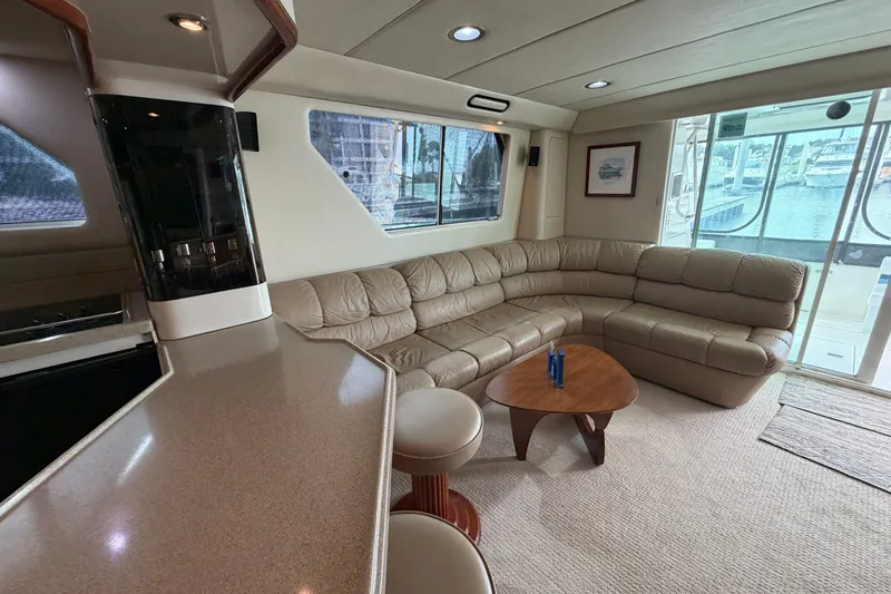 Slide: The Image of Luxurious interior of 1997 Sea Ray 550 Sedan Bridge yacht with leather seating and modern decor. - 45