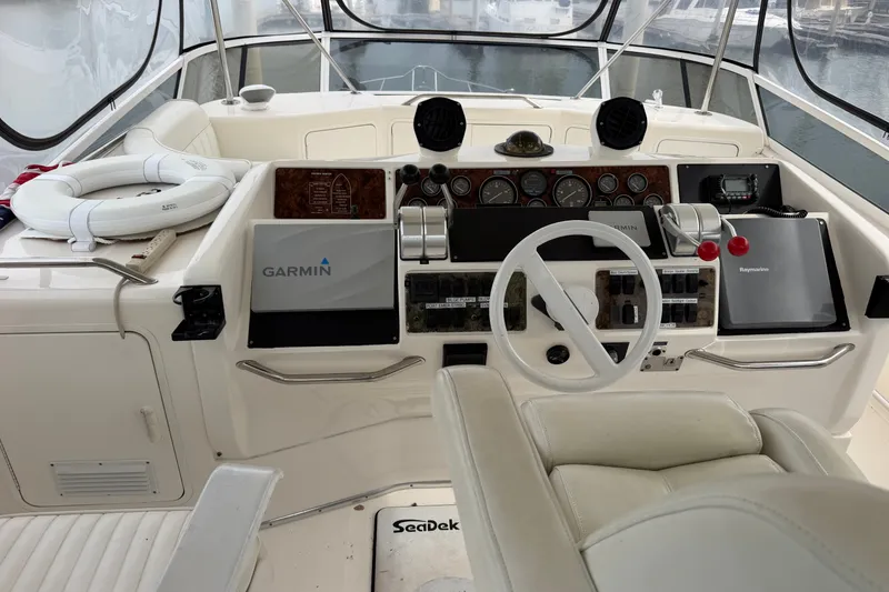 Slide: The Image of Cockpit of a 1997 Sea Ray 550 Sedan Bridge with Garmin navigation system. - 15