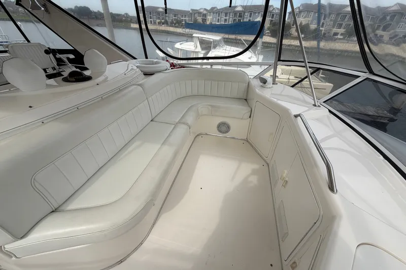 Slide: The Image of Luxurious seating area on a 1997 Sea Ray 550 Sedan Bridge yacht. - 12