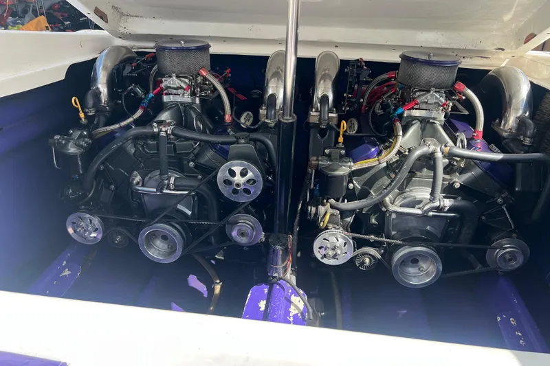 Slide: The Image of Twin engines in a 2000 Active Thunder 32 boat, showcasing detailed mechanical components. - 25