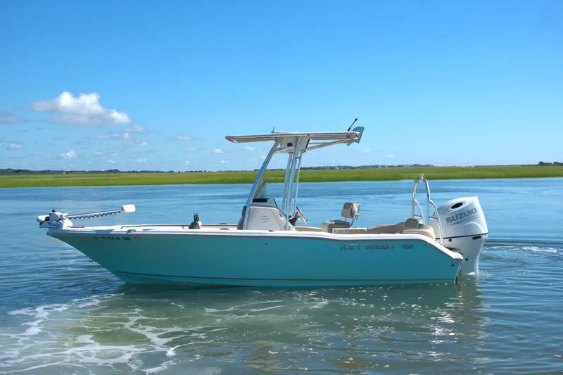 Slide: The Image of 2024 Key West 203 FS boat on calm water under clear blue sky. - 5