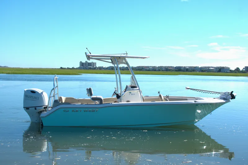 Slide: The Image of 2024 Key West 203 FS boat on calm water with clear blue sky. - 3